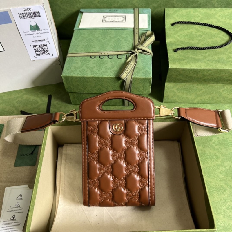 G*u*i top handle bags